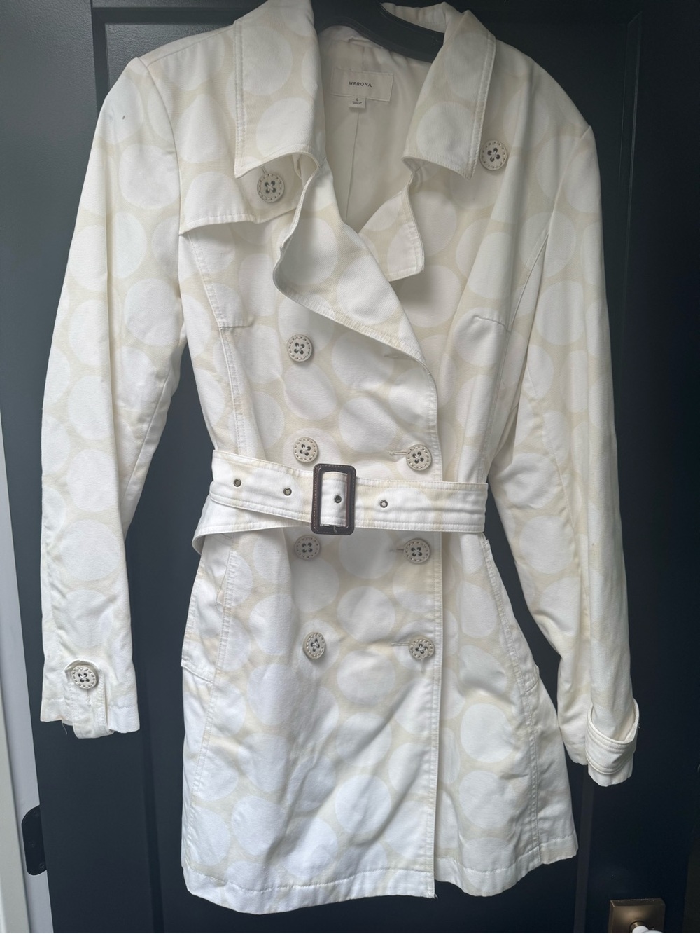 Tan and white polkadot trenchcoat mid length